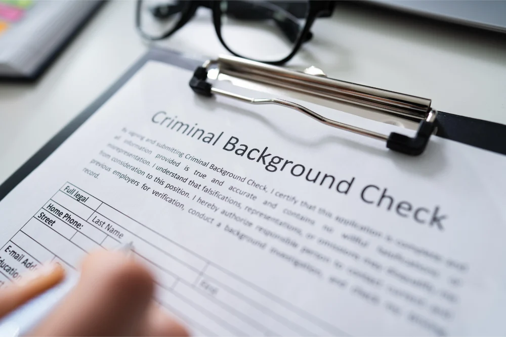 hand filling criminal background check application form Suspension du casier judiciaire